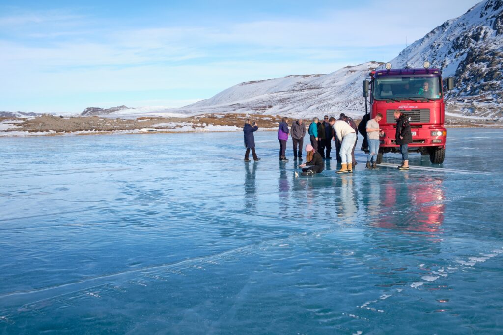 Driving on one of the frozen lakes between Kangerlussuaq and the Greenland Ice Sheet